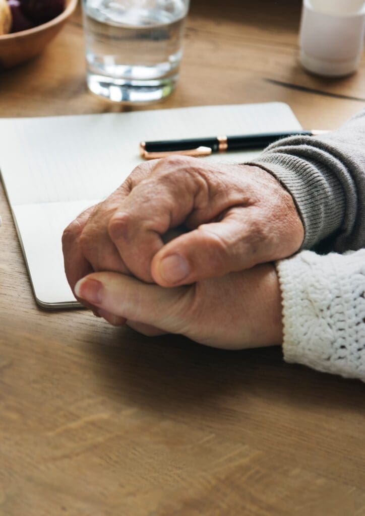 Senior married coupple comforting each other and holding hands
